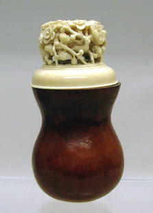 Chinese Gourd and Ivory Cricket Cage Box: The ivory lid finely pierced and carved as a tall cluster of blooming branches above a pierced fretwork lid top, natural patina to the gourd. 5"h x 2 ½"w.