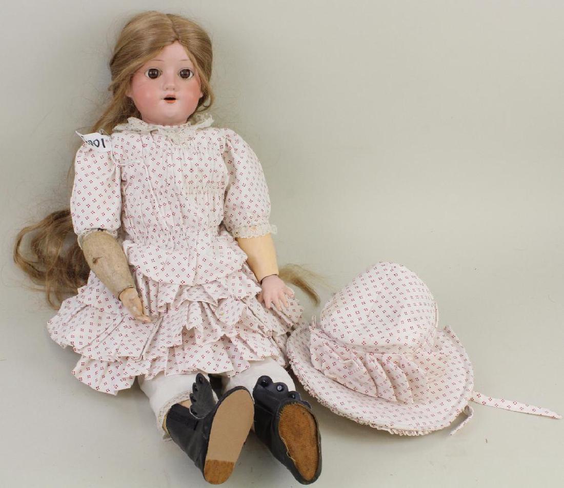 ANTIQUE BISQUE DOLL - 22" MOA (IN STAR) GERMANY 200 5.: Brown sleep eyes, open mouth, synthetic wig. Papier mache ball jointed body. Dressed in vintage reproduction clothing. Condition: factory chip on rim edge otherwise nothing observed on bisque after ca