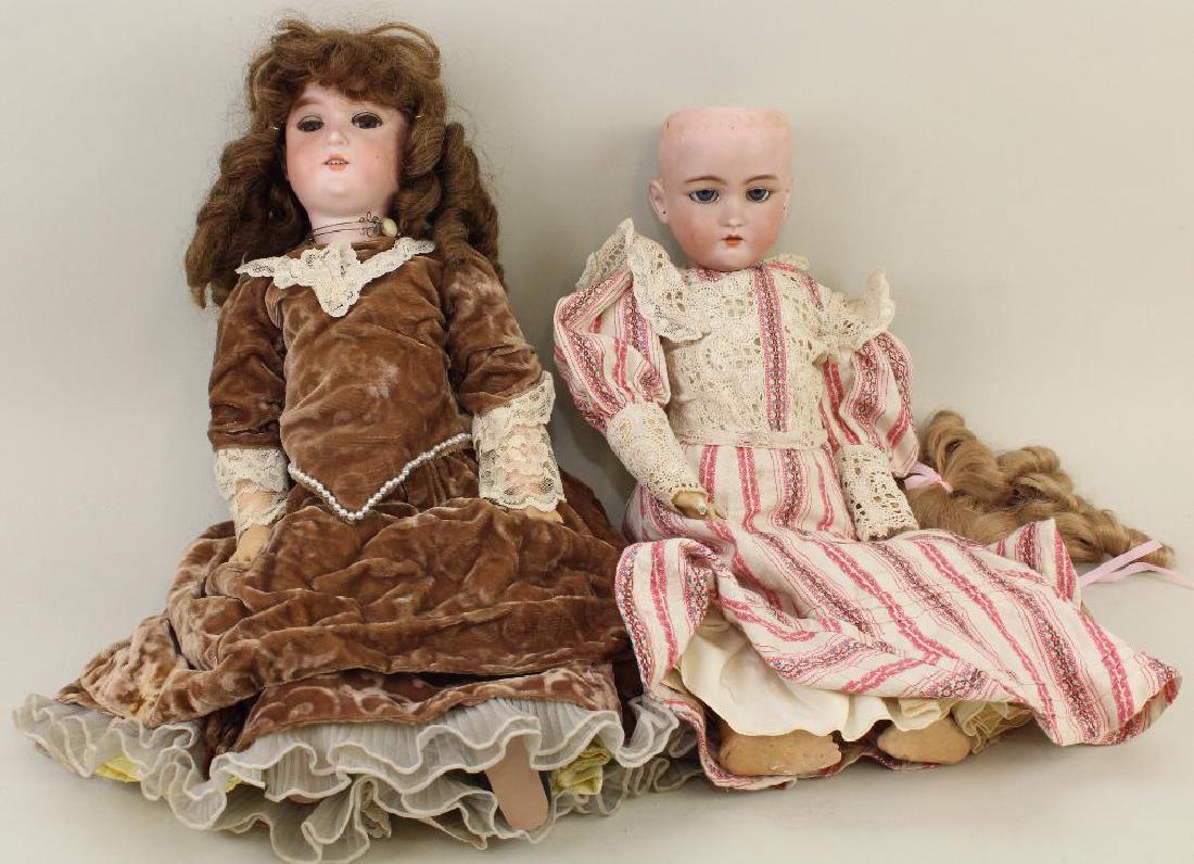 BODY PARTS - PAIR OF ANTIQUE BISQUE HEAD DOLLS. (1 of 3)