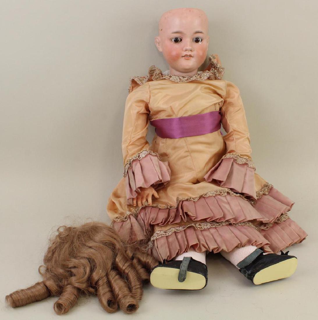 BODY PARTS - 29 1/2" MADE IN GERMANY ARMAND MARSEILLE: Brown sleep eyes, open mouth, synthetic wig. Papier mache ball jointed body (almost French style). Dressed in reproduction clothing. Condition: chip under left eye, head has been restored. Body has be