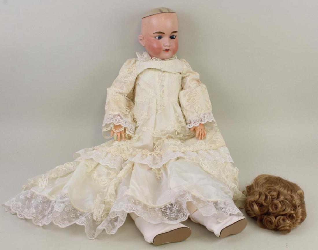 BODY PARTS - 33" ARMAND MARSEILLE 390 A.12 M BISQUE: Blue sleep eyes, open mouth, synthetic wig. Papier mache ball jointed body. Newer clothing. Condition: head has been restored. Body has been repainted. Finger repair. This lot is being sold AS IS.
