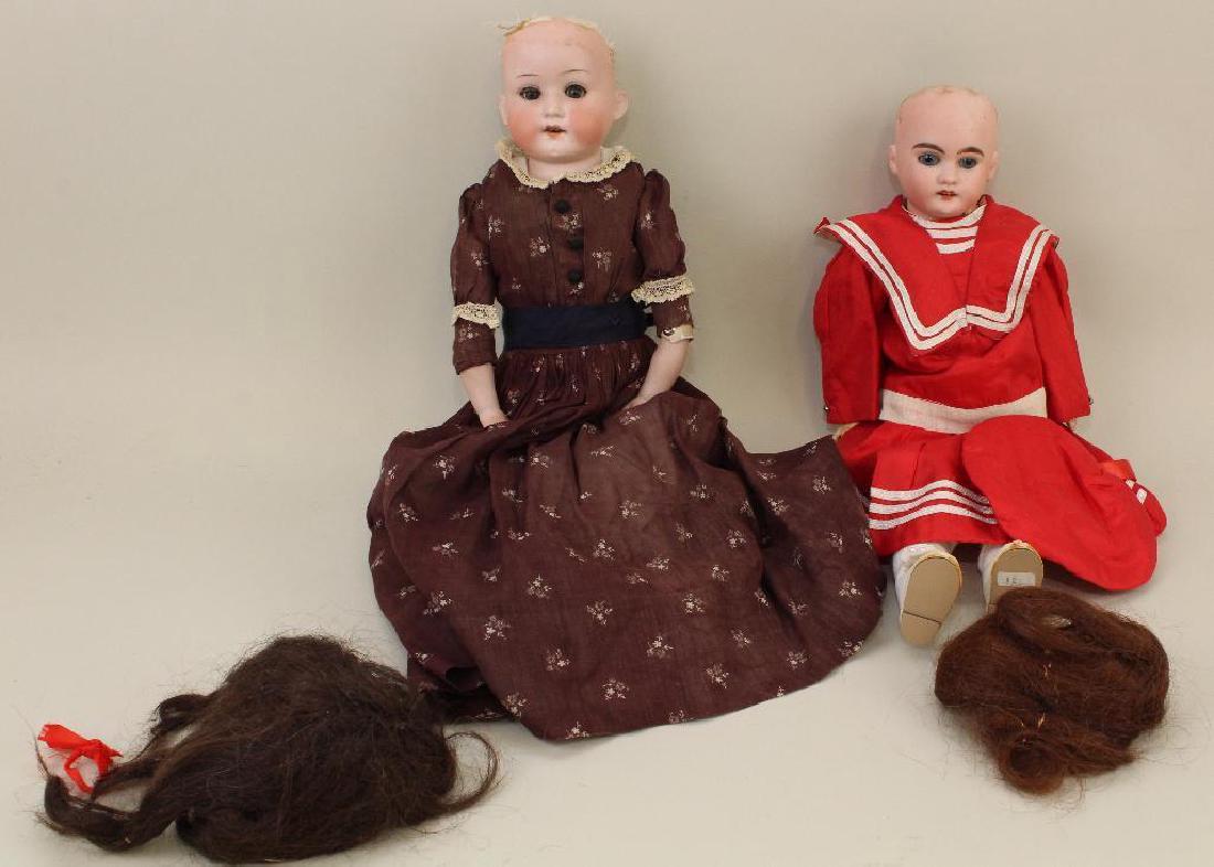 PAIR OF ANTIQUE BISQUE HEAD DOLLS. (1 of 3)