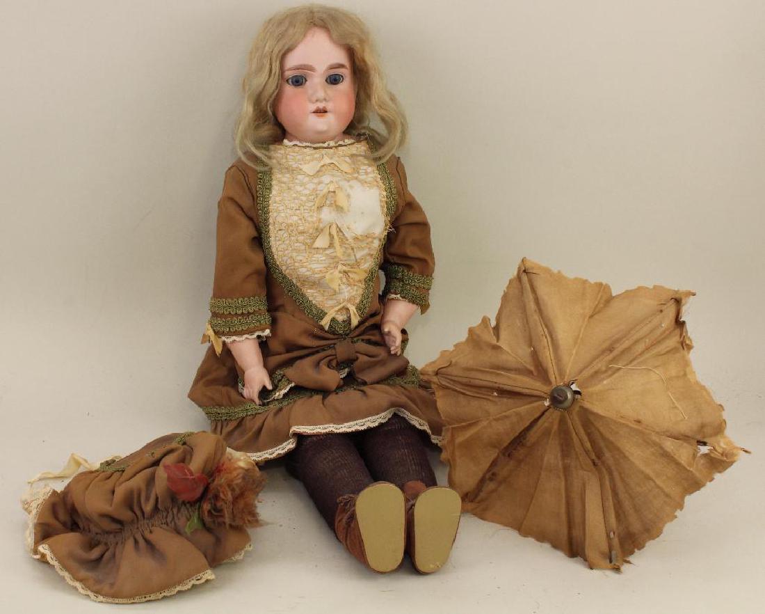 BODY PARTS - 26" FLORADORA A-7-M MADE IN GERMANY: Blue sleep eyes, open mouth, blonde mohair wig. Pin jointed leather body is marked (illegible paper label) and has bisque lower arms. Dressed in vintage clothing. She has an antique parasol with her. 