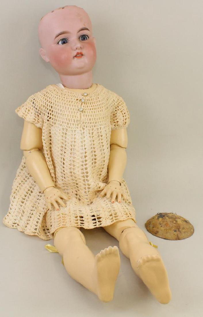 BODY PARTS - 34" A.15.M.: Blue sleep eyes, open mouth. No wig. Papier mache ball jointed body. Child's crocheted dress. Condition: nothing observed on bisque after careful examination. Body has been completely repainted. Doll 
