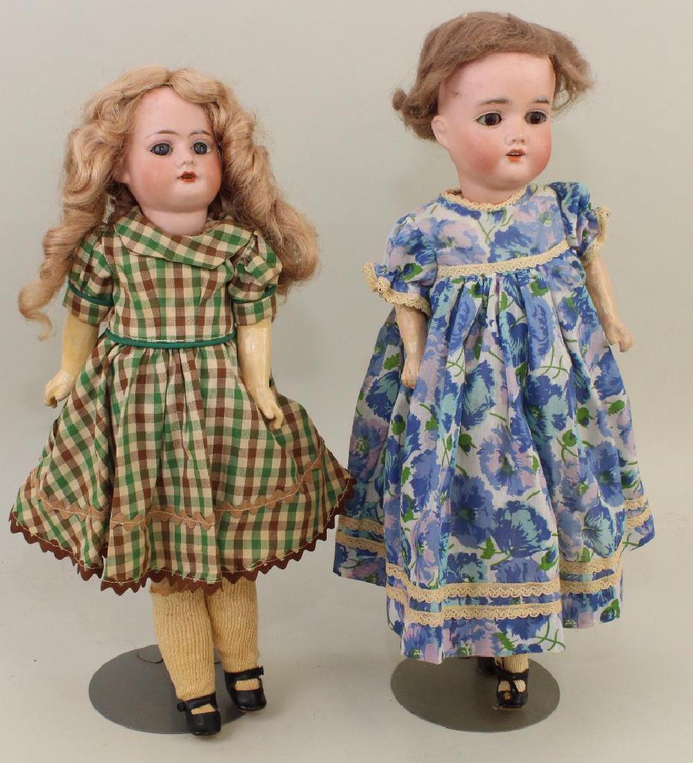PAIR OF ANTIQUE BISQUE HEAD DOLLS.: Both dolls have sleep eyes, open mouths, 5 pc. papier mache bodies. 16" 1 0 MADE IN GERMANY. Synthetic wig. Antique and vintage clothing, oilcloth shoes. 17" GBR. 185 K 1 GERMANY. Mohair wig. Vintage 