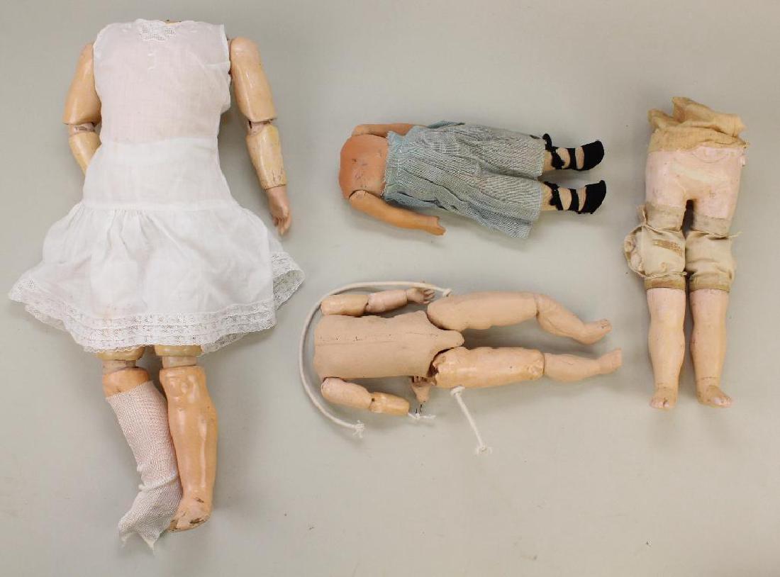 BODY PARTS - LOT OF (4) PAPIER MACHE BODIES.: 11" Jointed body. 17" Fully jointed body. Bottom portion of a Motschmann body - papier mache lower torso and legs connected by cloth. Overall 10" 9 1/2" 5 Pc. Body. Condition: this lot is being sold A