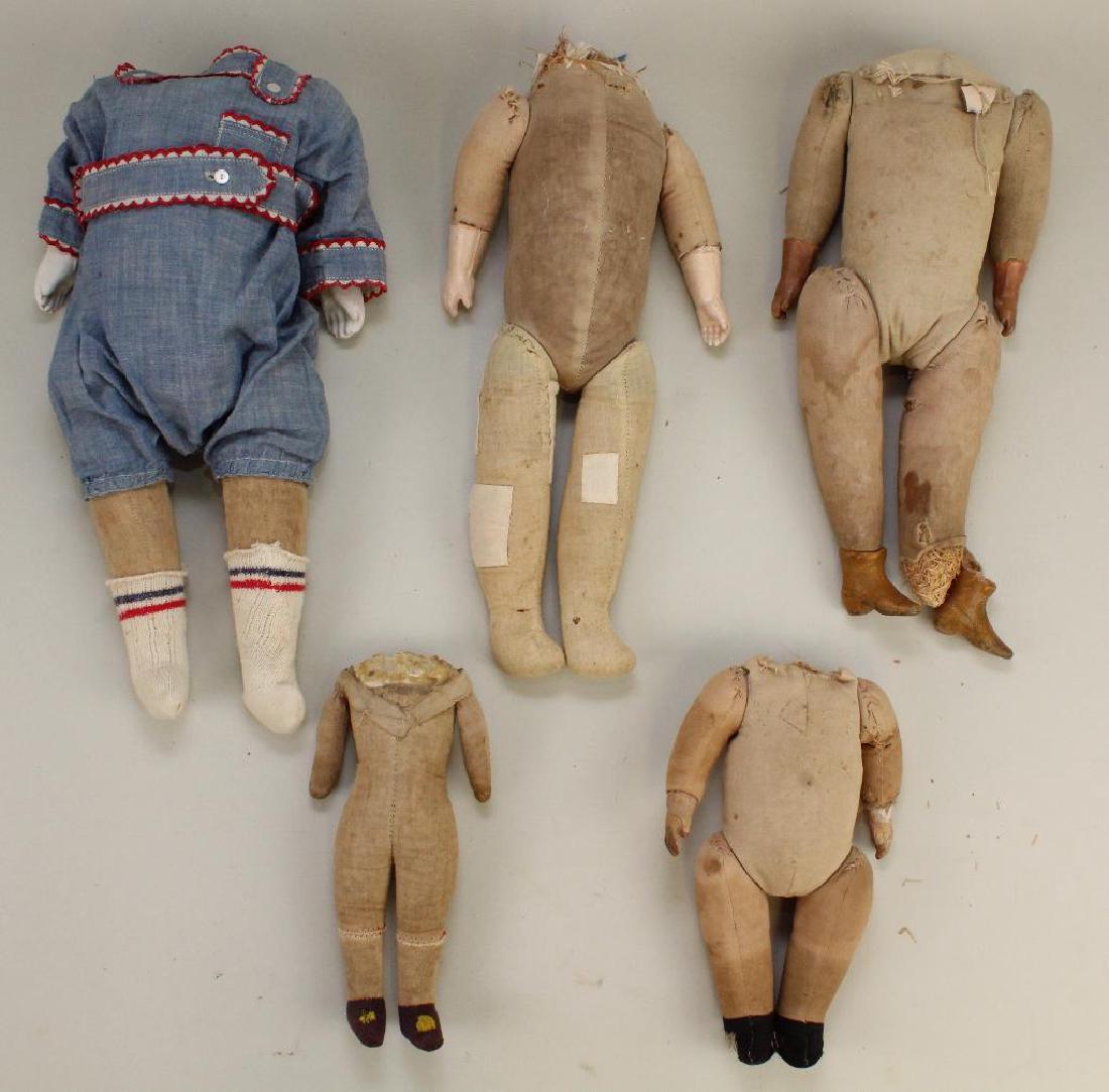 BODY PARTS - LOT OF (5) ANTIQUE CLOTH BODIES.: All of these bodies would have had shoulder heads. 7 1/2" All cloth. 8" Cloth with composition hands. 12" Cloth with composition hands and molded boots (damage). 13" All cloth (repaired). 13" Cloth wi