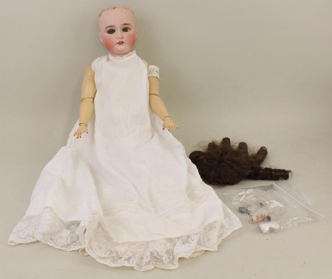 BODY PARTS - 22" 29.5 G 165/7 K GERMANY 7 ANTIQUE: Open mouth, synthetic wig. Papier mache ball jointed body. (2) Long antique baby petticoats. Condition: nothing observed on bisque after careful examinatin. Sleep eye mechanism is in lot but damaged. 