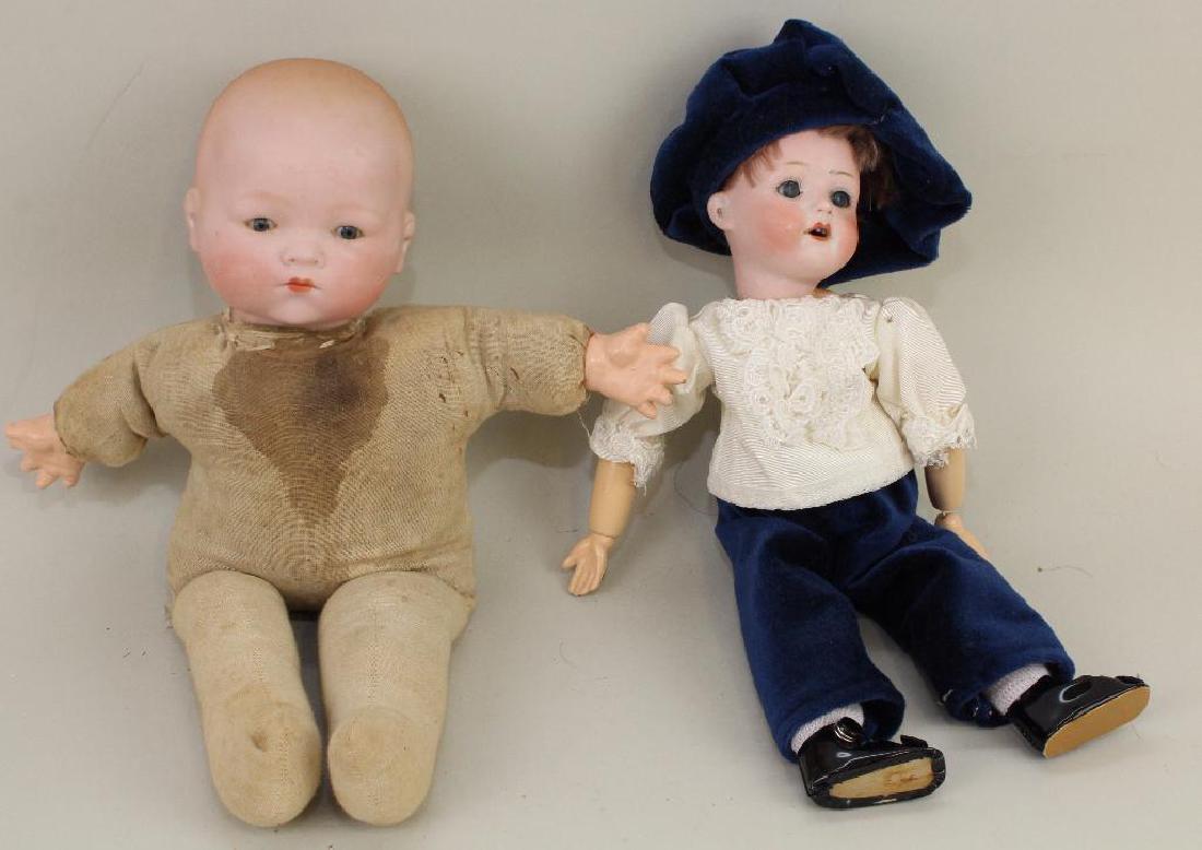 BODY PARTS - PAIR OF ANTIQUE BISQUE HEAD DOLLS. (1 of 3)