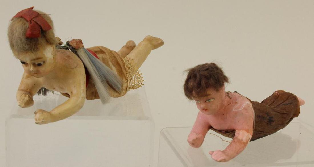 PAIR OF WAX OVER PAPIER MACHE ANGELS.: Both angels have their original mohair wigs. Both are missing whatever they were originally holding. 5 1/2" Angel has crepe paper clothing. (Wings missing.) 6 1/2" angel has her original clothing and 