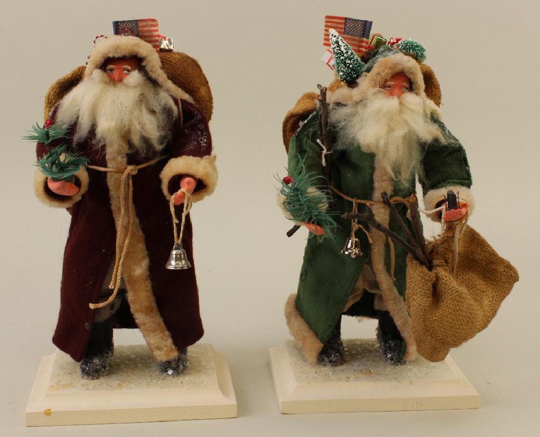 PAIR OF SANTAS BY ARTISTS TWINS FEATHER TREES. (1 of 3)
