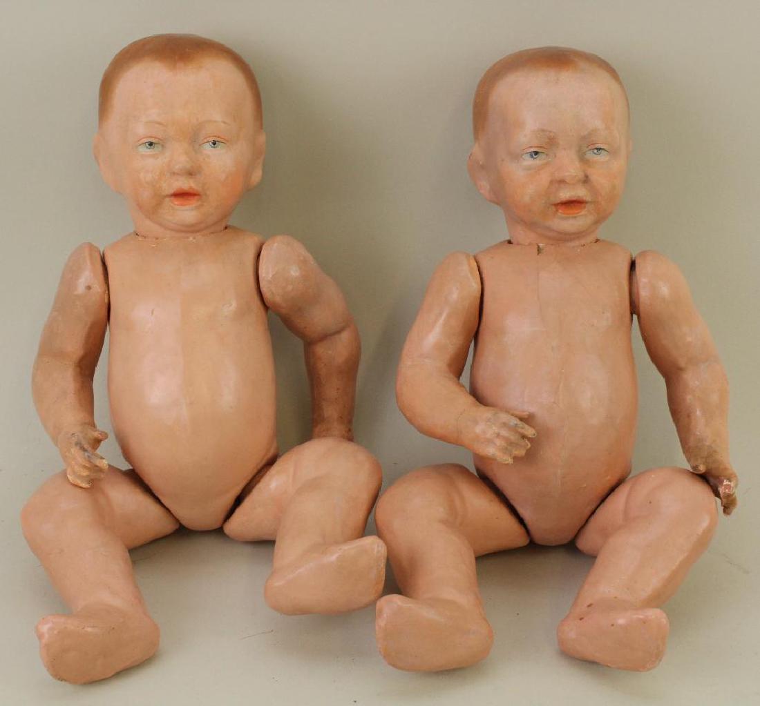 PAIR OF 15" UNMARKED SOLID DOME PAPIER MACHE TWIN: Both dolls have painted features - blue eyes, open/closed mouths, light brown hair. 5 Pc. bent limb baby bodies. NO clothing. Condition: minor paint touch up on both dolls. (1) Doll has loss to thumb 