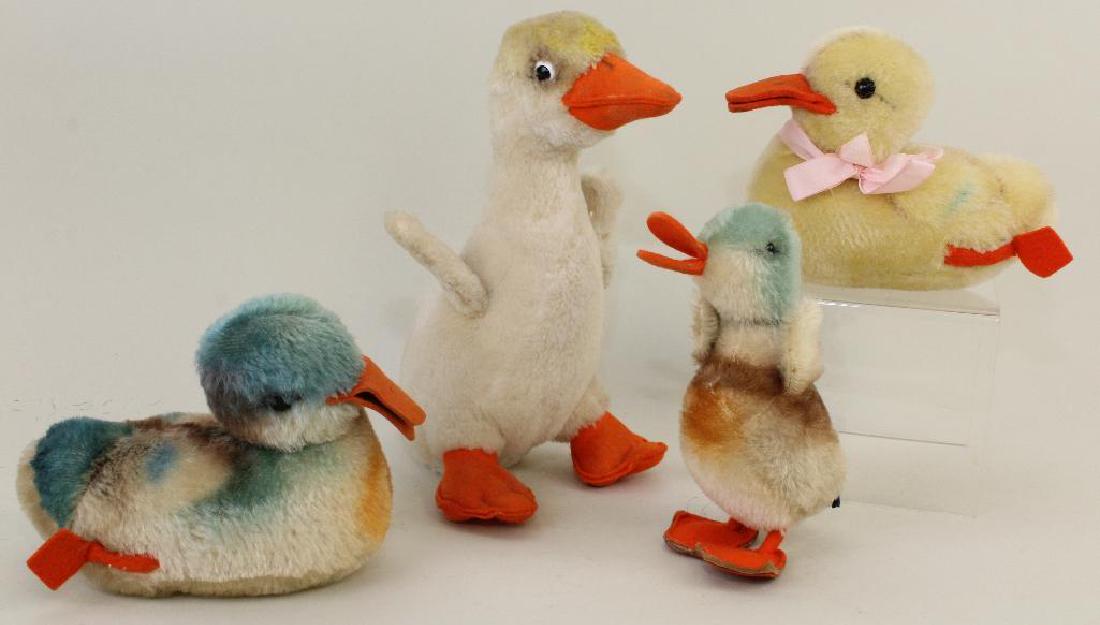 LOT OF (4) STEIFF DUCKS.: All of the ducks have orange felt beaks and feet. (3) Unmarked mohair ducks of various colors. (1) Tagged plush duck with incised silver button, yellow tag. Condition: minor age discoloration.