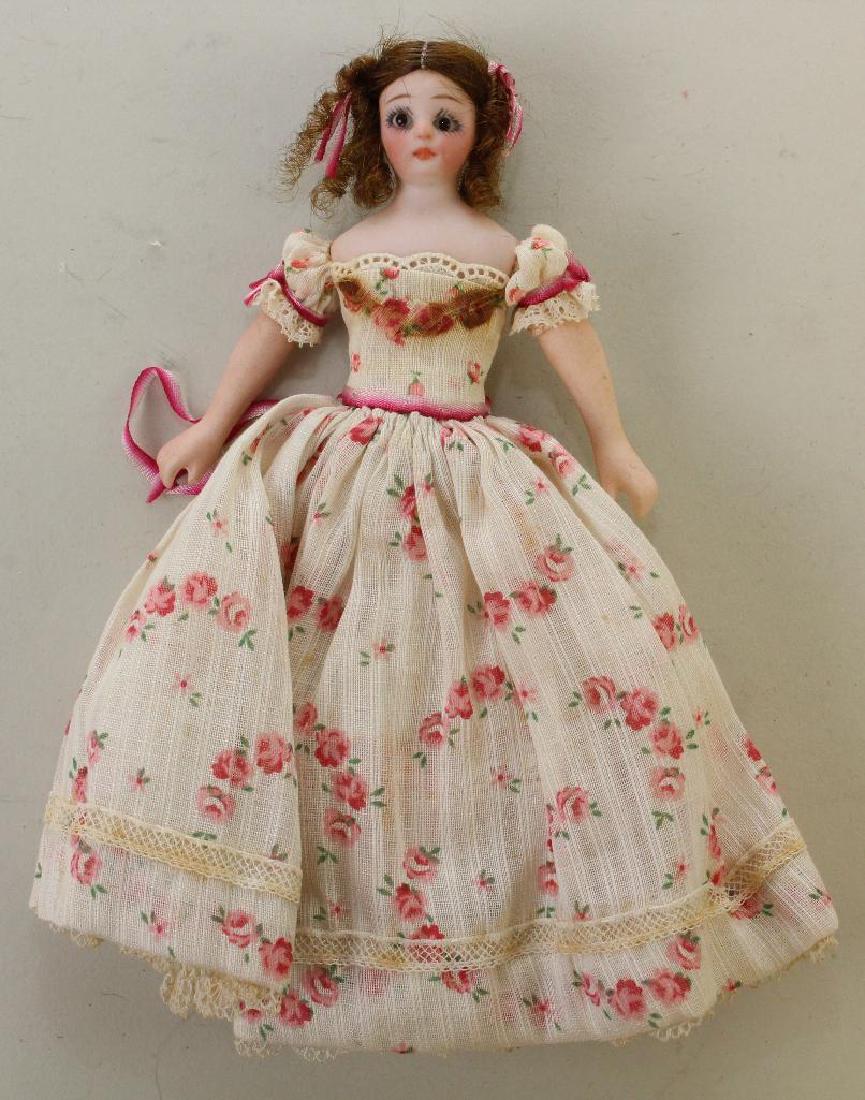 6" S & H 1160 "LITTLE WOMAN" ANTIQUE BISQUE SHOULDER: Stationary black eyes, closed mouth, brown mohair wig with coiled braid on back. Cloth body with bisque lower limbs, painted shoes. Dressed in vintage dimity outfit in the period of the doll. Conditio