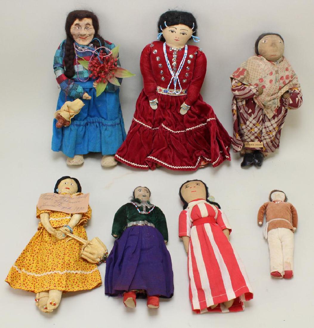 LOT OF (7) ALL ORIGINAL NATIVE AMERICAN DOLLS.: Dolls are 7" - 12". Tagged Navajo Indian woman from an Indian Reservation in Arizona created by Jeanette Ver Meulen. Tagged Ottawa Indian. Tagged Apache Squaw doll made of chamois by Louise Dyck 1970.