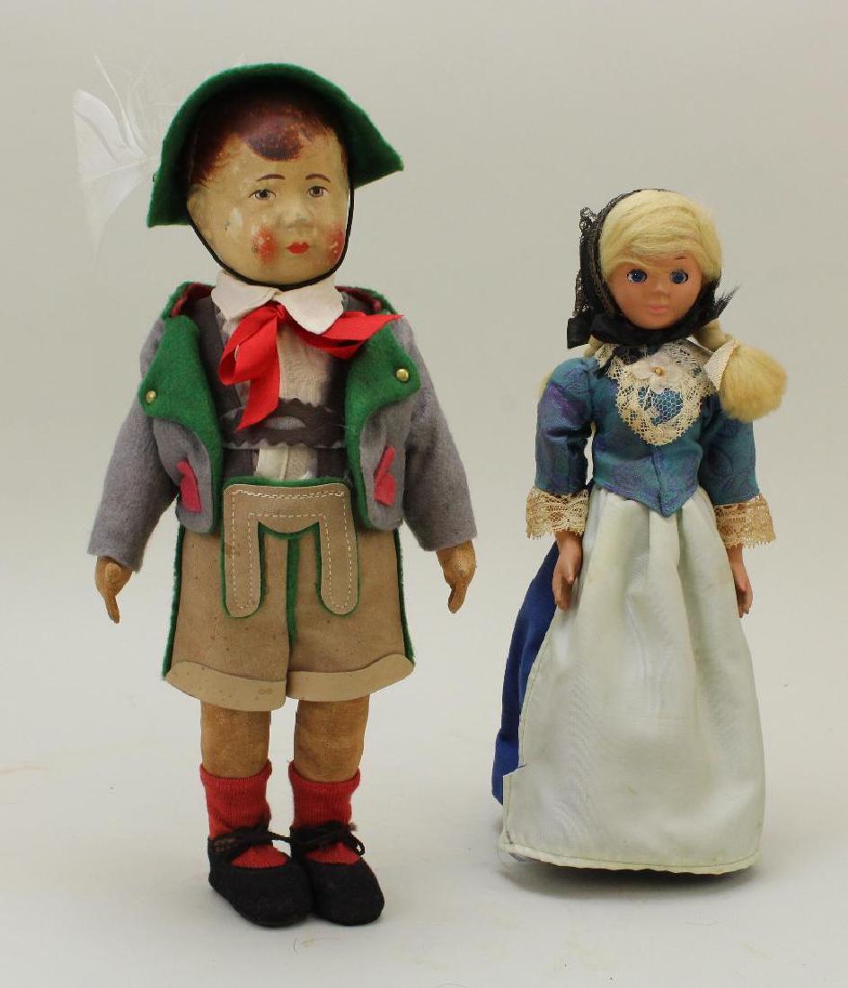 PAIR OF DOLLS: 12" UNMARKED KRUSE TYPE & 10" SWISS: 12" Unmarked Bing/Kruse type doll - all original painted cloth head with painted, molded features. Cloth 5 pc. body, swivel head. Original leather and felt clothing, shoes. Stand. Condition: loss of p
