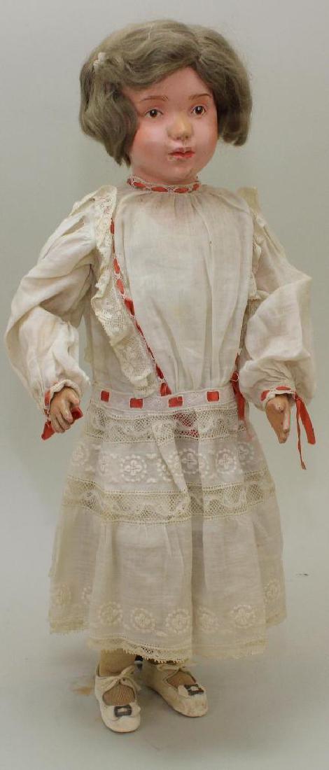 19" SCHOENHUT MODEL NO. 311 WIGGED DOLL.: This doll has the incised mark on the back of torso. Brown integlio eyes, original tosca mohair wig. She is wearing her factory original union suit, socks and white leather Mary Jane shoes. Antique wh
