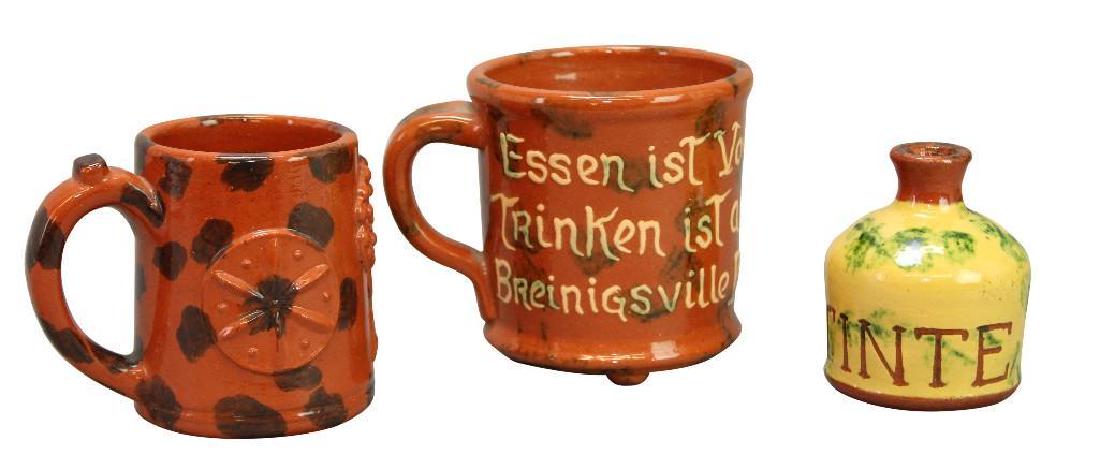 James C. Seagreaves Pottery Grouping: (2) paint decorated mugs and (1) bottle. All signed "JCS". Tallest 4.75"h x 5.5"w