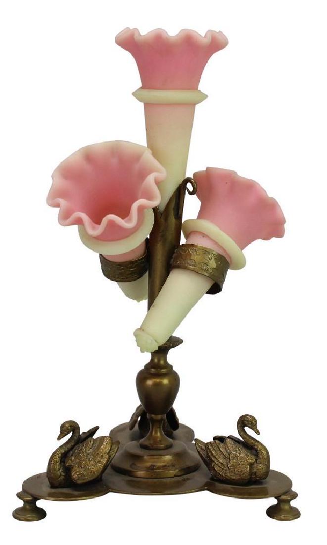 Victorian Burmese Glass Epergne: (3) Pink to yellow Burmese glass flutes with applied rings in brass swan decorated base. 9.25" x 5.25"w x 5.25"d