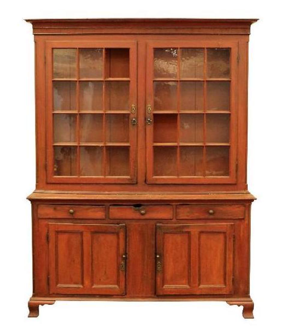 PA Dutch Cupboard in Red Wash: two piece cupboard with 2 door, 12 light top, matchstick molding, resting on a 3 drawer, 2 door base with conforming match stick panel, ogee feet, rat hole in center drawer. 93.5"h x 70"w x 20"d