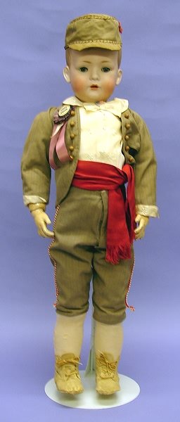 German Bisque: Bisque. German bisque 28" BSW (Bruno Schmidt). BSW (in heart) 2048-6 character boy. Mold imperfection on right ear. Solid dome with molded and painted hair. Stationary blue eyes, open mouth with woggl