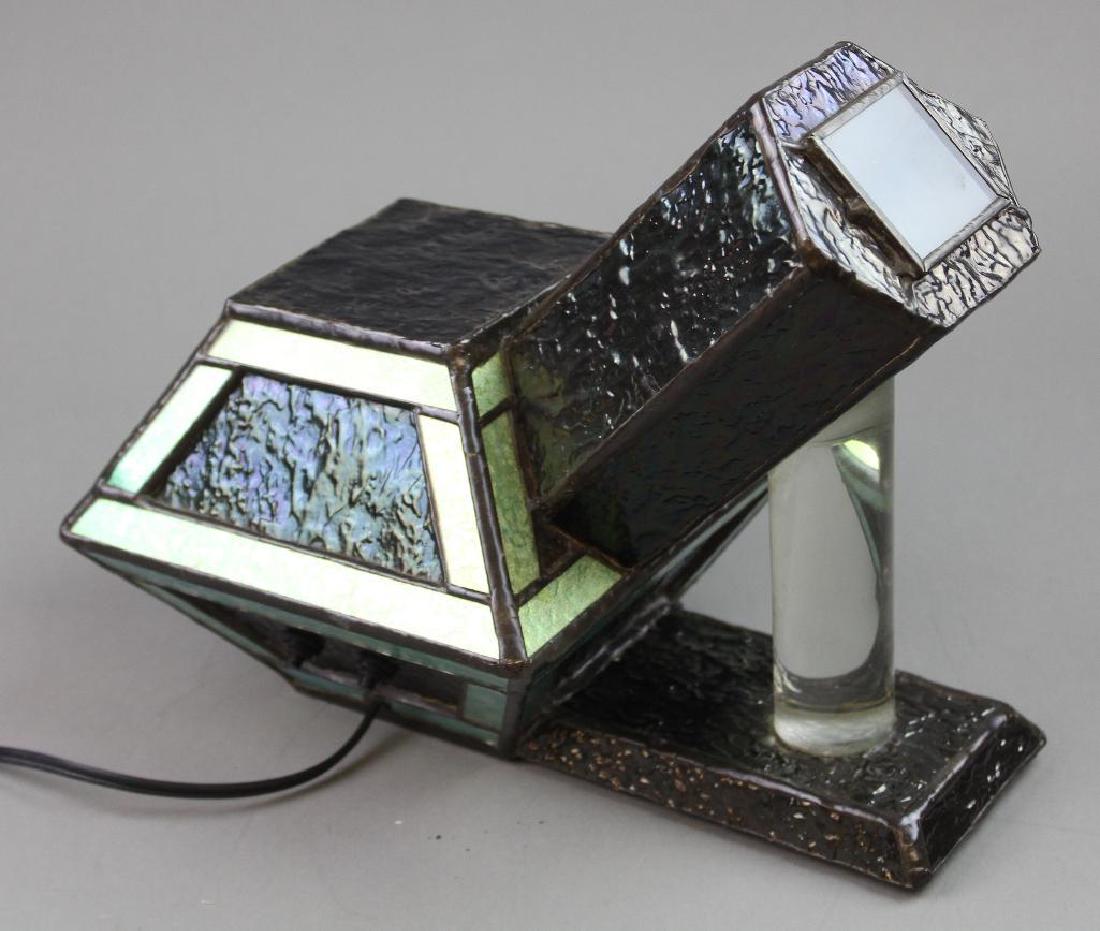 Bob Ade Kaleidoscope, "Crystal Rapture": Electrified textured stained glass with plastic tube, trapezoid- turtle like shape. L12" x H10". "Crystal Rapture", by Bob Ade.