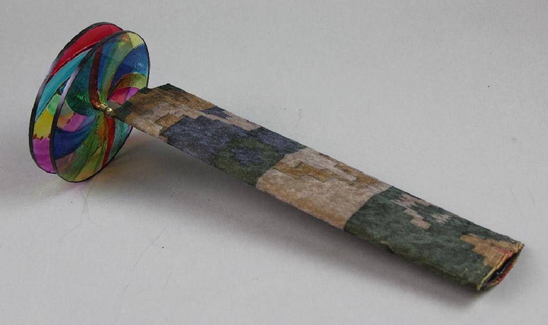 Southwest Style Kaleidoscope: Southwest style fabric covered rectangular with 2 colored plastic wheel discs. 11"