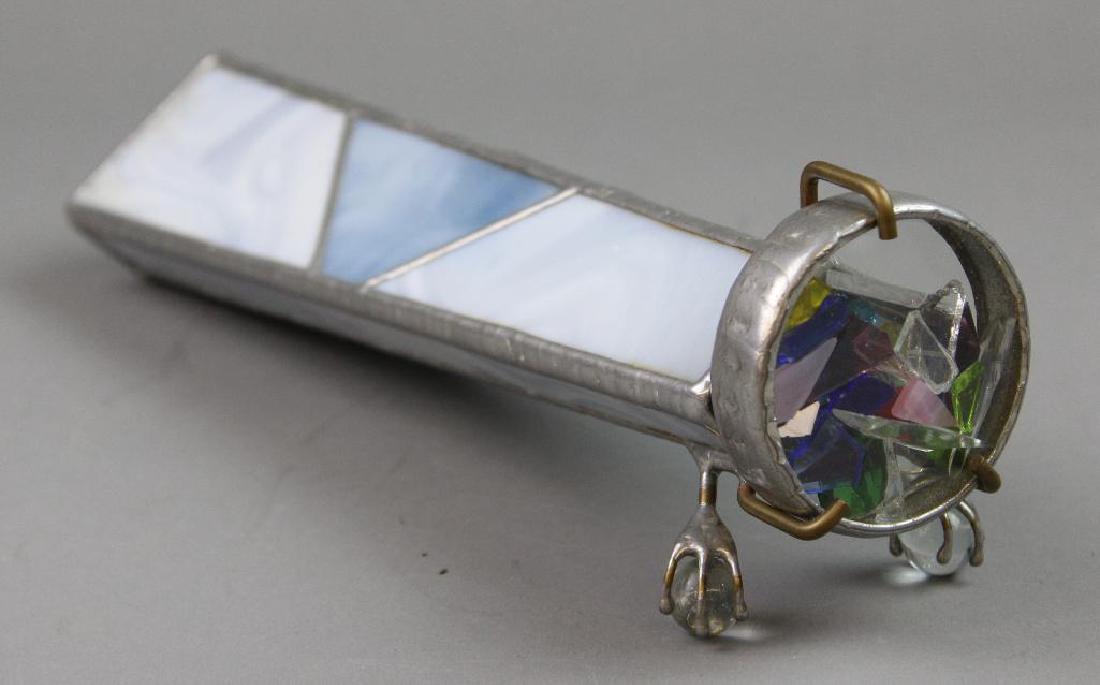 Geometric Kaleidoscope: Geometric shape blue and white stained glass and metal. With two ball and claw feet. 12"