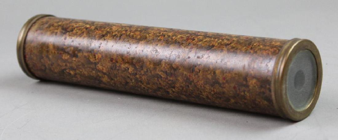Metal Kaleidoscope: Model painted metal cylinder with brass ends and glass viewing beads. 9"