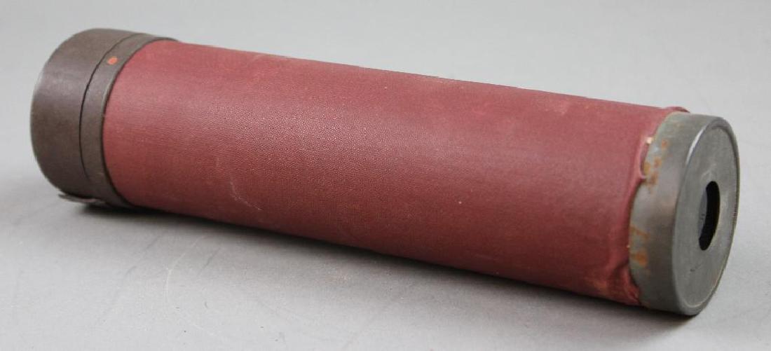 Leather/Paper Kaleidoscope: Hand Held Kaleidoscope. Leather/paper (red) with brass ends. "Patent applied for". Measures 8 1/2"