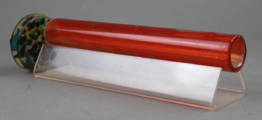 Orange Glass Kaleidoscope: Orange glass cylinder with two multi-colored viewing