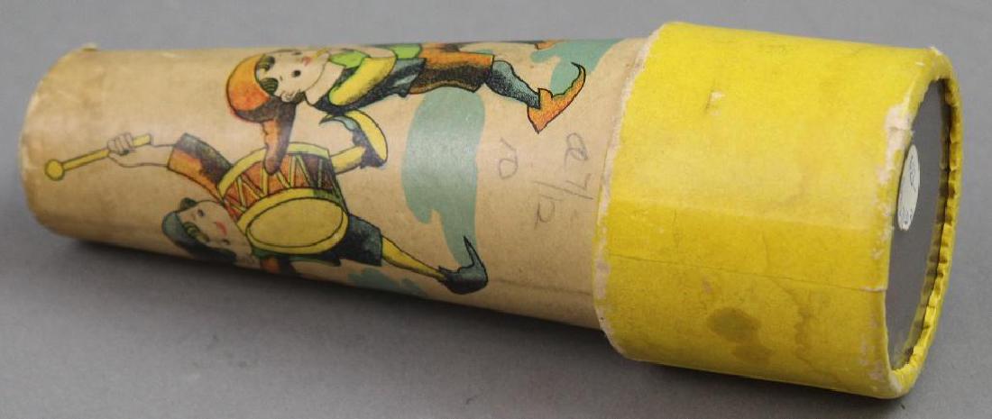 Cardboard Children's Kaleidoscope: Cardboard Hand-held Child's Scope with musicians illustration. "Patent ZW". 5 1/2". Yellow pastels.