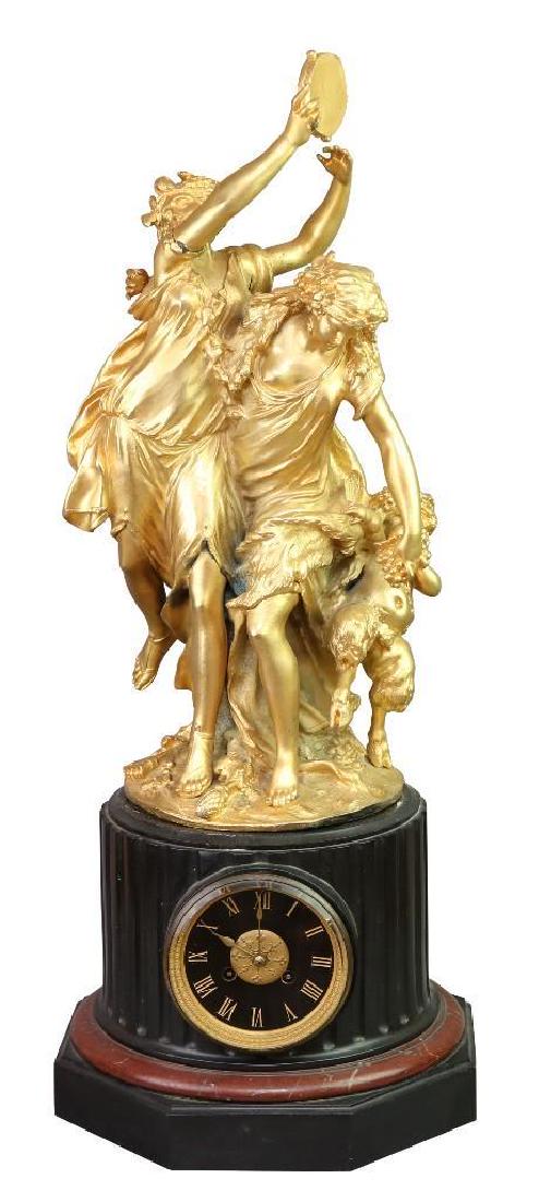 Figural Ormolu Mantel Clock: French, late 19th c. Black & Red Griotte Marble and Gilt Bronze 31 1/2" H x 11" W x 11 1/2" D Fire gilded bronze 8 day mantel clock with black and red Griotte marble base roman numerals, two Bacchante