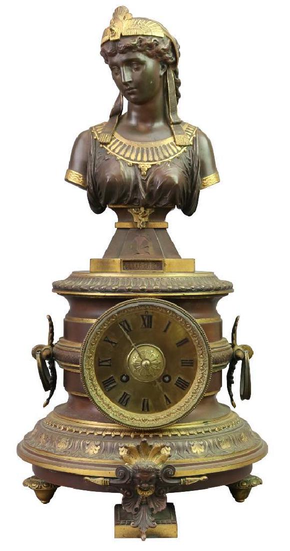 Cleopatra Figural French Bronze Mantel Clock: French, 19th c. Bronze 18 1/2" H x 9 1/2" W x 9 1/2" D French 8 day mantel clock with Cleopatra bust to top, all bronze case with fire gilded bronze details, set on a circular base. Marked A. Lemaire,