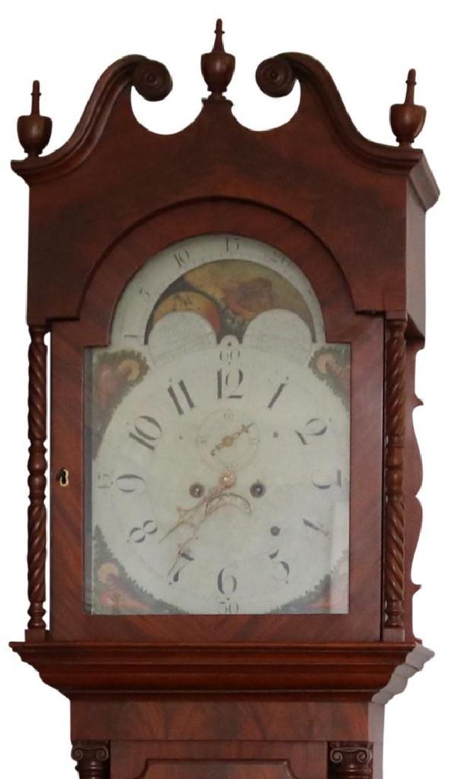 William Gibbons, Walnut Tall Case Clock: American, circa 1820 Walnut 94" H x 19" W x 10" D Tall case clock, swan neck hood with arched door & turned columns with wood capitals & finial, arched trunk door with reeded quarter side columns. Arc