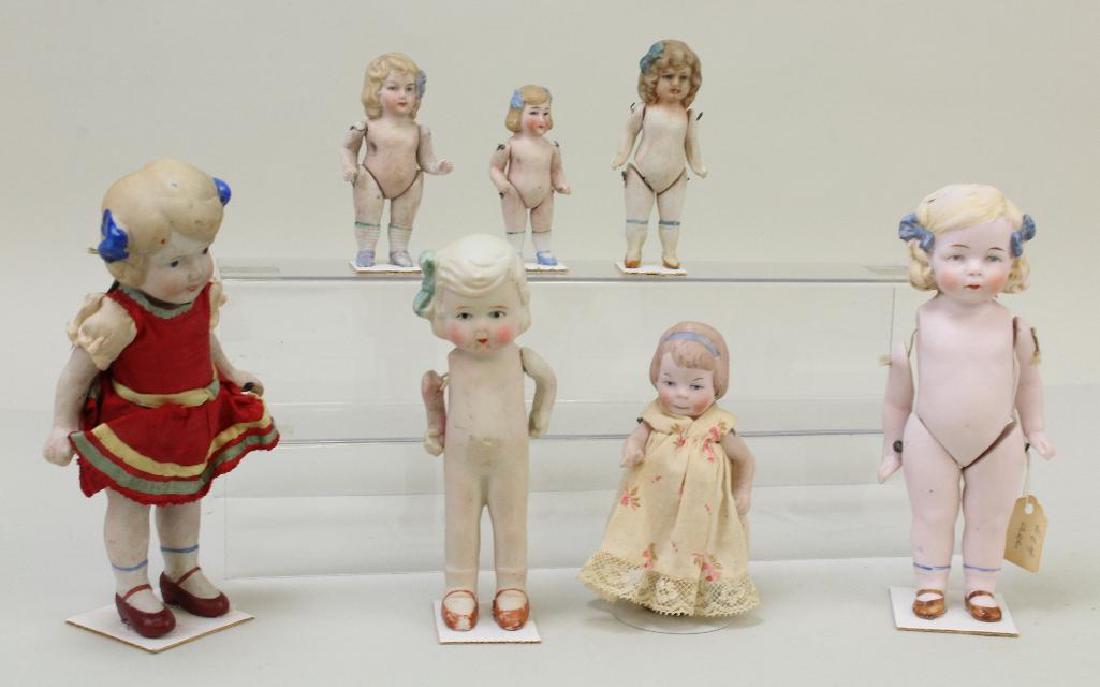 LOT OF (7) ALL BISQUE ANTIQUE DOLLS WITH MOLDED BOWS, (1 of 3)