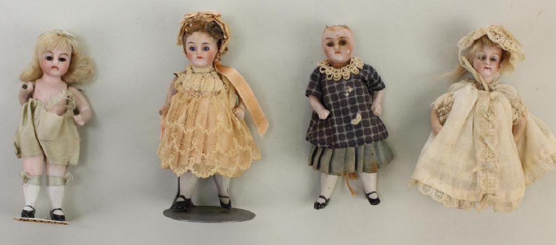 LOT OF (4) ALL BISQUE ANTIQUE DOLLS WITH GLASS EYES. (1 of 2)