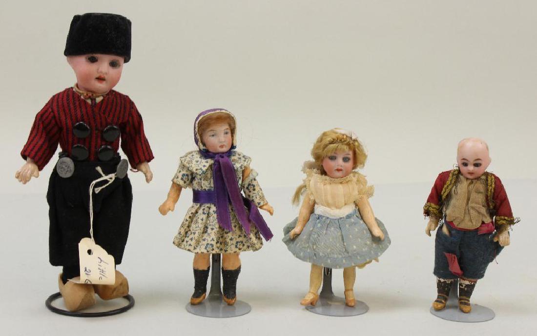 LOT OF (4) ANTIQUE BISQUE HEAD DOLLS. (1 of 2)