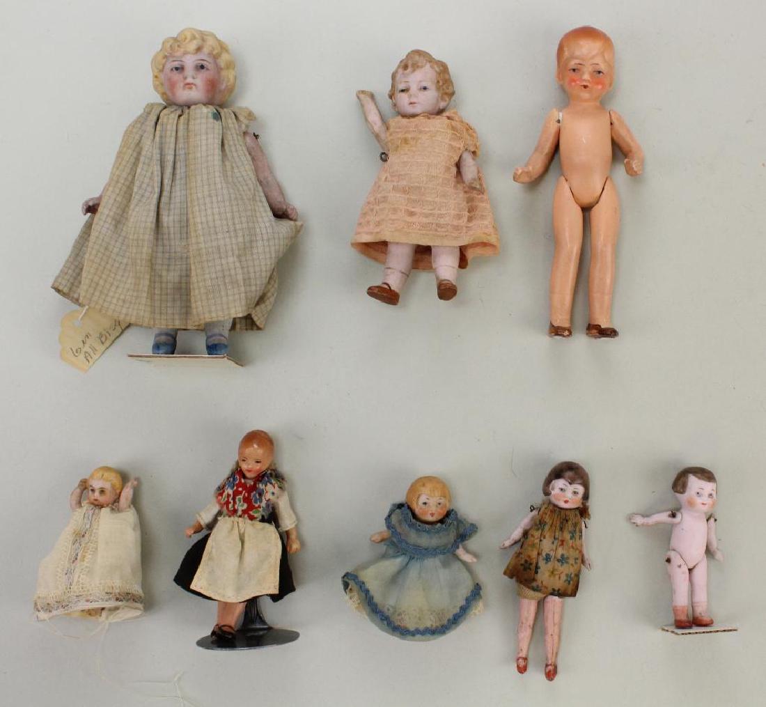 LOT OF (8) ALL BISQUE ANTIQUE DOLLS WITH PAINTED EYES. (1 of 2)