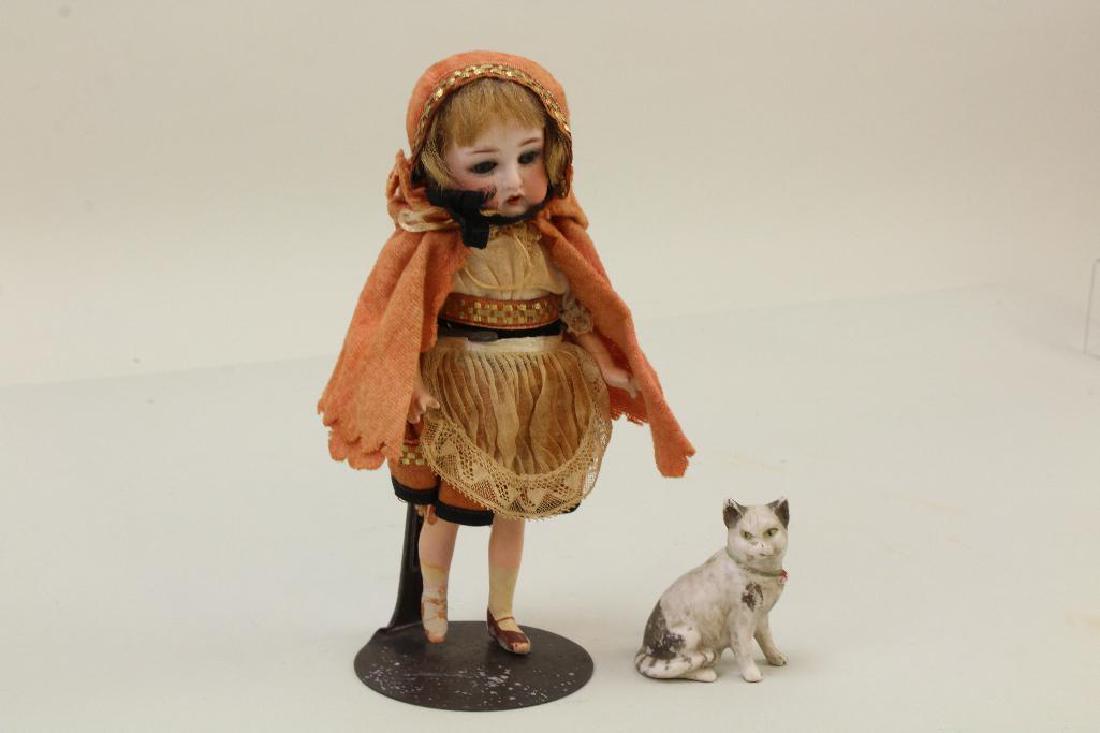 ANTIQUE BISQUE HEAD DOLL  WITH HER CAT. (1 of 4)