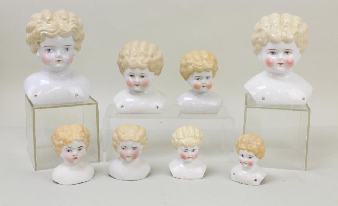 LOT OF (8) ANTIQUE CHINA/PARIAN LOWBROW SHOULDER: All of the heads have blonde hair, blue eyes. China - heads measure 2 1/2", 2 3/4", 4", 4 1/2", 5 1/2'. Only (1) has pale cheek coloring, the others have higher coloring. Only (4) of the heads are mar