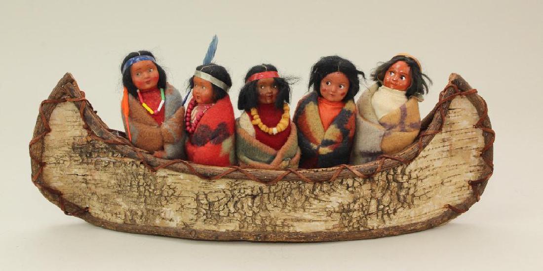 LOT OF (5) ALL ORIGINAL SKOOKUM/TYPE DOLLS IN CANOE. (1 of 4)