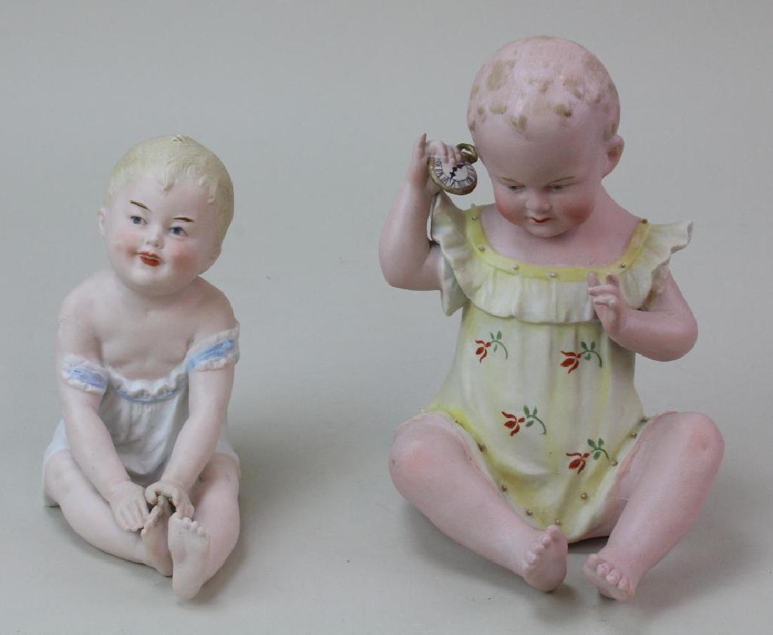 PAIR OF ANTIQUE  PIANO BABY FIGURINES. (1 of 3)