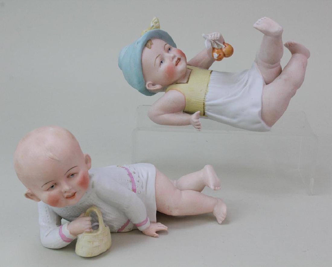 PAIR OF ANTIQUE PIANO BABY FIGURINES. (1 of 3)