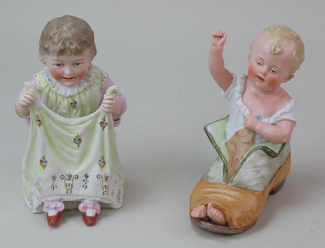 PAIR OF ANTIQUE PIANO BABY FIGURINES. (1 of 2)