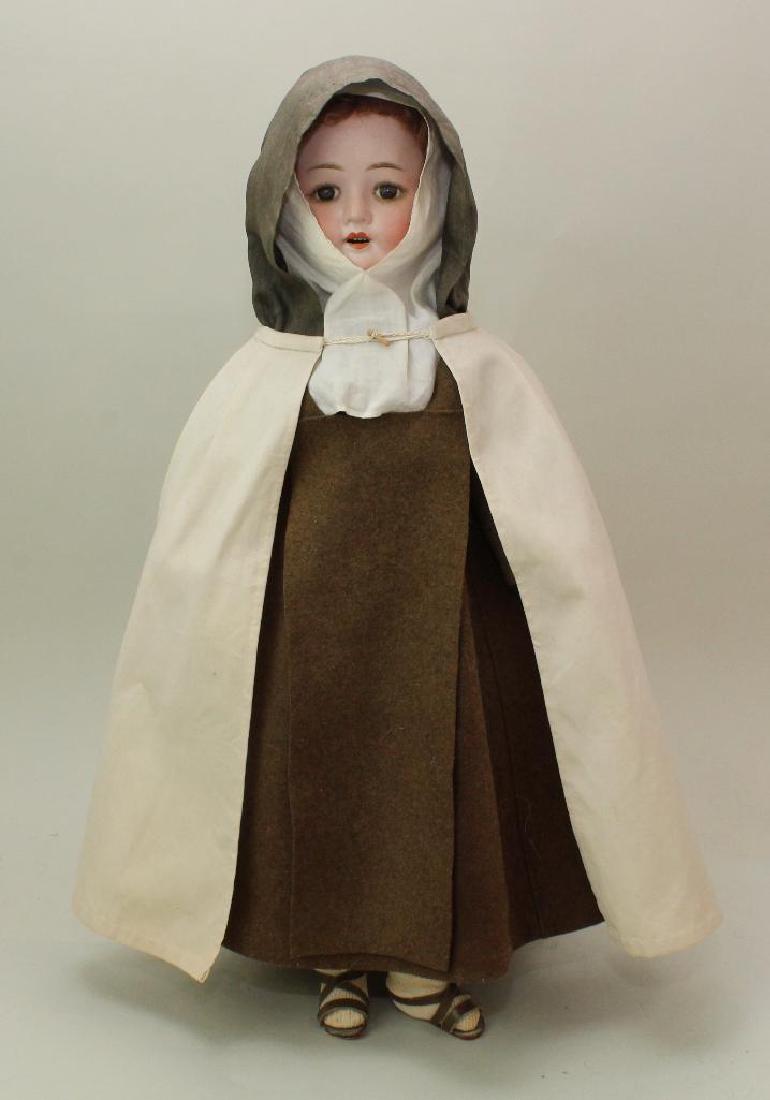 23" GW(?) 120 MADE IN GERMANY 10 ANTIQUE BISQUE HEAD: Stationary brown eyes, open mouth, brown mohair wig. Papier mache jointed body. Dressed in antique clothing: brown wool Habit with ivory cotton cape. Brown twill underskirt with secret pocket around w
