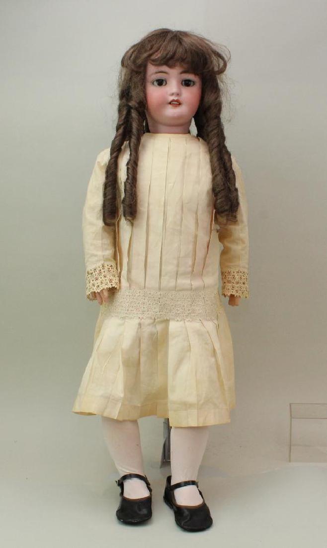 34" 1078 GERMANY SIMON & HALBIG S&H 15 ANTIQUE BISQUE: Brown sleep eyes, open mouth, pierced ears, brown synthetic wig. Papier mache ball jointed body. Dressed in antique child's pale pink cotton dress with rickrack trim. Newer teddy; vintage shoes. Condi