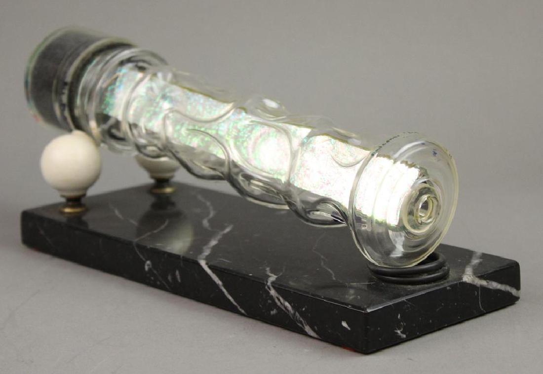 D and D Falconer Kaleidoscope: "Ice Cave" D and D Falconer. Ice Cave #11. Glass cylinder shape with thumb print indents. Rests on two porcelain balls on marble base. 11"L