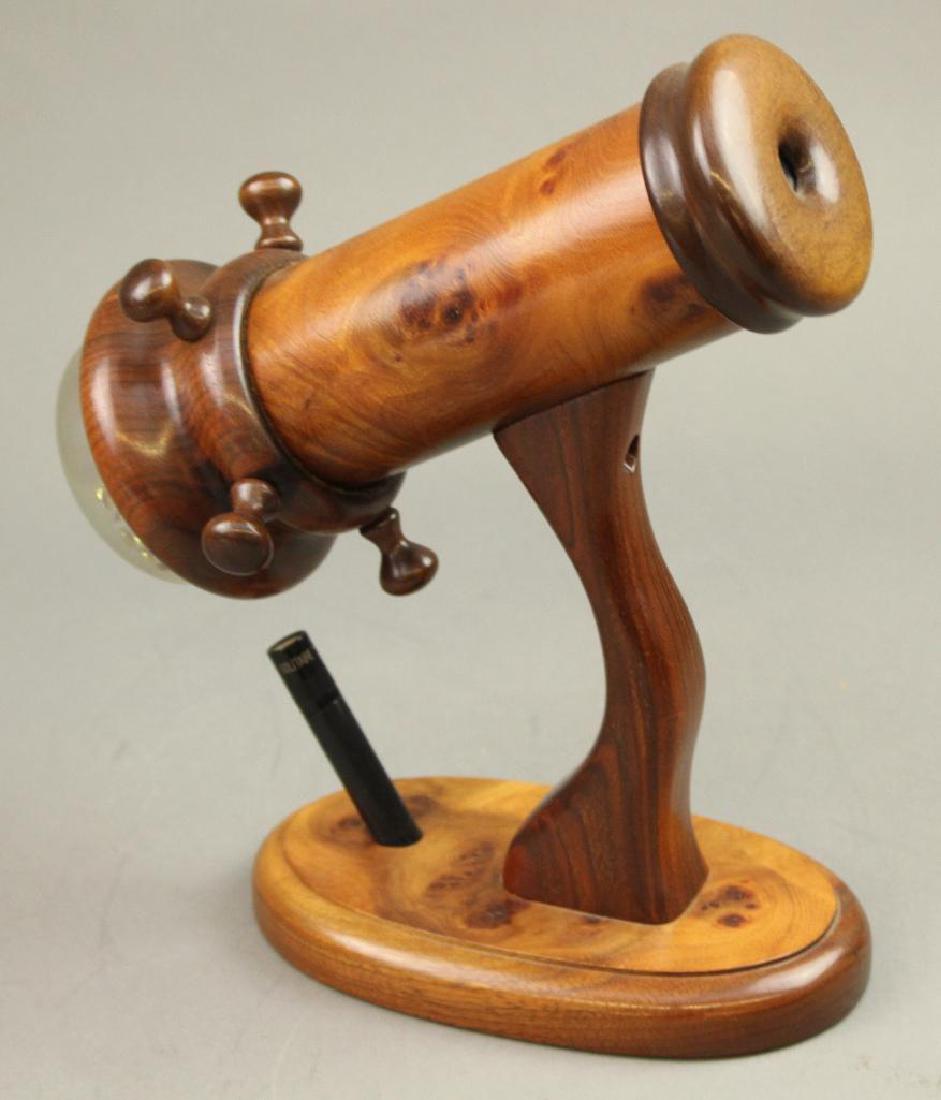 Randy and Shelley Knapp Kaleidoscope: "Cloud Nine" by Randy and Shelley Knapp. Burled wood with small flashlight in stand. 11"H