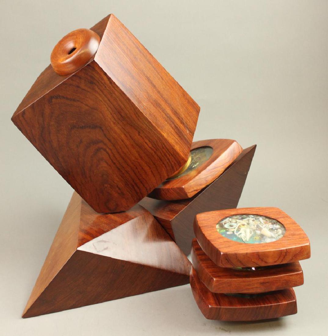 Paretti Kaleidoscope: "Whimsy" by Paretti. Wood geometries with spinning viewer (three different pieces). Viewing objects in liquid on disc. 8 total viewing discs. 15"H